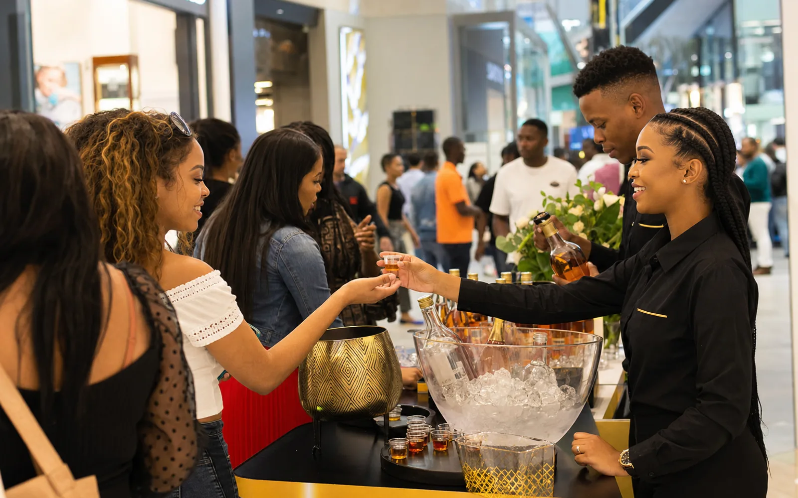 Promoters at a mall sampling desk during a retail launch in Gauteng